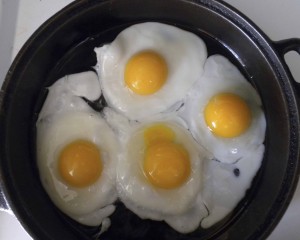 Sheri's pastured eggs Health-giving, pastured eggs frying in cast iron pan could be restricted under the USDA's proposed dietary guidelines.