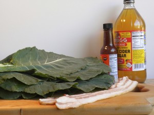 Collard Greens Ingredients for traditional collard greens with natural bacon, organic hot sauce, and unfiltered organic apple cider vinegar.